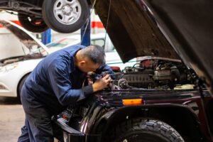 Mechanic inspecting